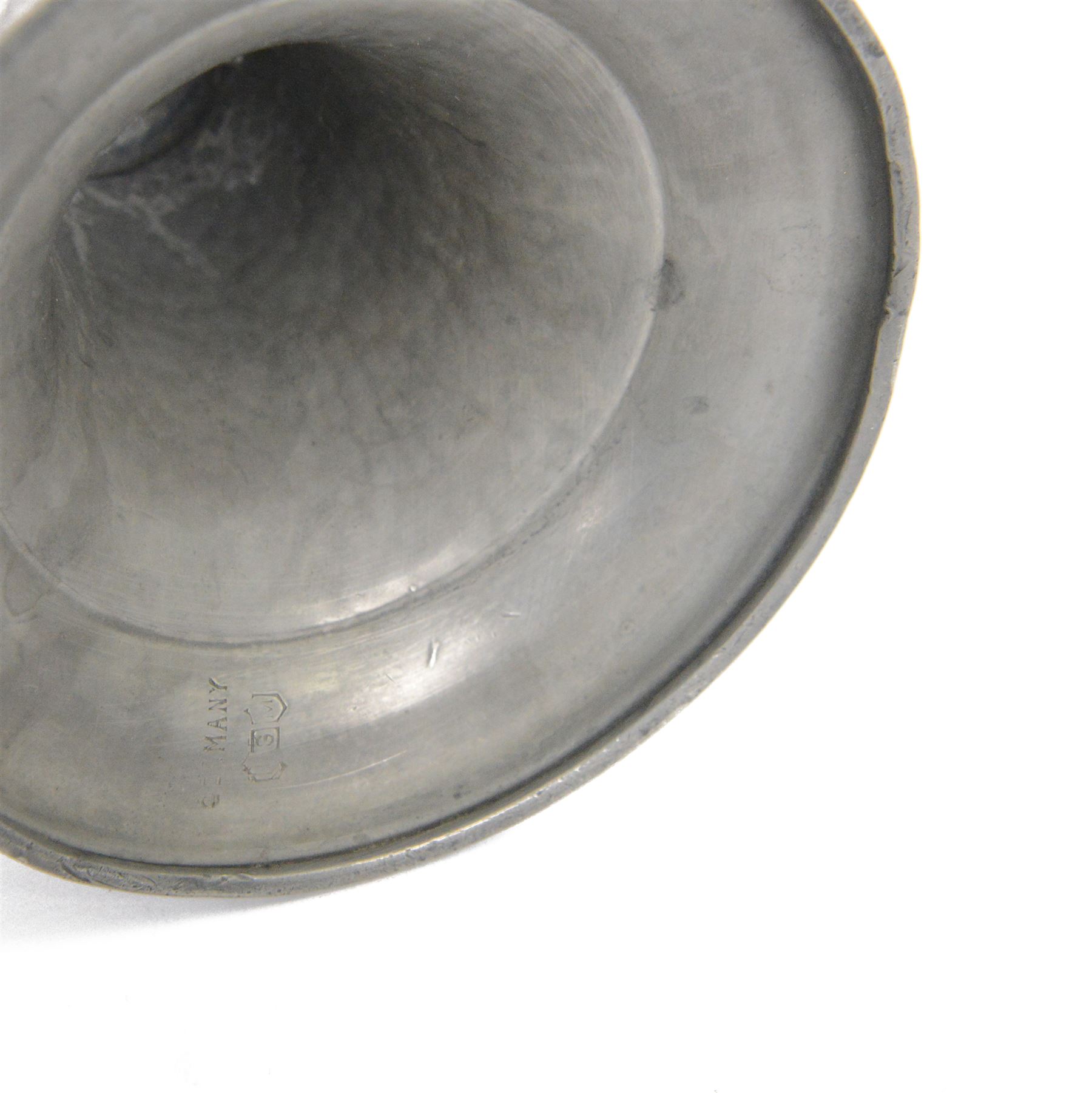 Pair of  Jugendstil hammered pewter candlestick each set with three blue and green enamel roundels, marked Germany beneath, H12cm