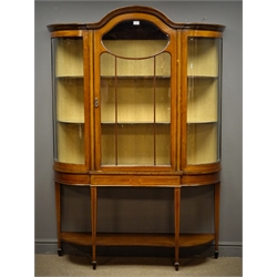  Edwardian inlaid mahogany display cabinet, shaped arched top, astragal glazed door enclosing lined interior with two shelves, square tapering supports joined by an undertier, spade feet, W132cm, H189cm, D38cm  