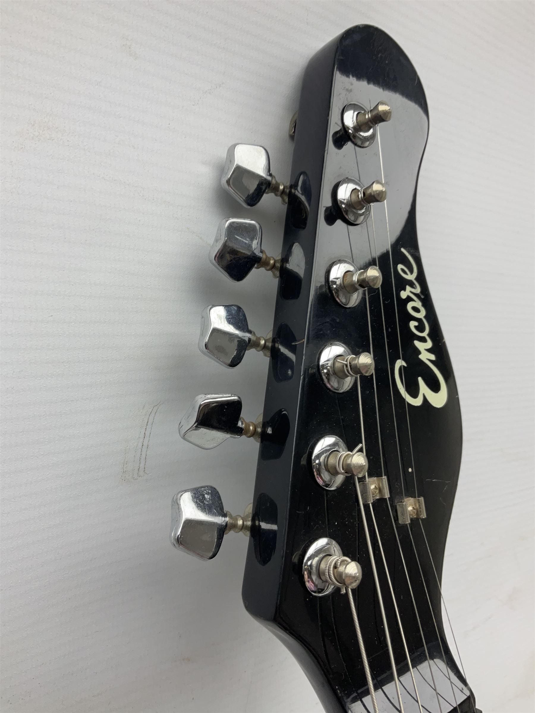 Encore black electric cut-away guitar L96cm; and Spanish Victor Garcia model 187 acoustic guitar, bears label dated 1972 L99cm; each in soft carrying case (2)