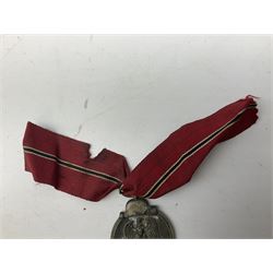 WW2 German Eastern Front Medal awarded to those who served on the German Eastern/Russian Front during the Winter Campaign period of 15th November 1941 to 15th April 1942 with original ribbon; and German War Merit Cross with swords 2nd Class (2)