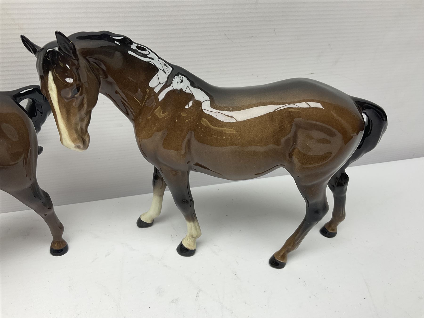 Four Beswick horses, including Exmoor no 1645, Black Beauty foal and two others 