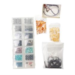 Collection of various beads, including turquoise, citrine, amethyst, garnet, iolite, ruby, onyx, hematite, rose quartz, smokey quartz, white quartz, lapis, amber, peridot, tourmaline, etc