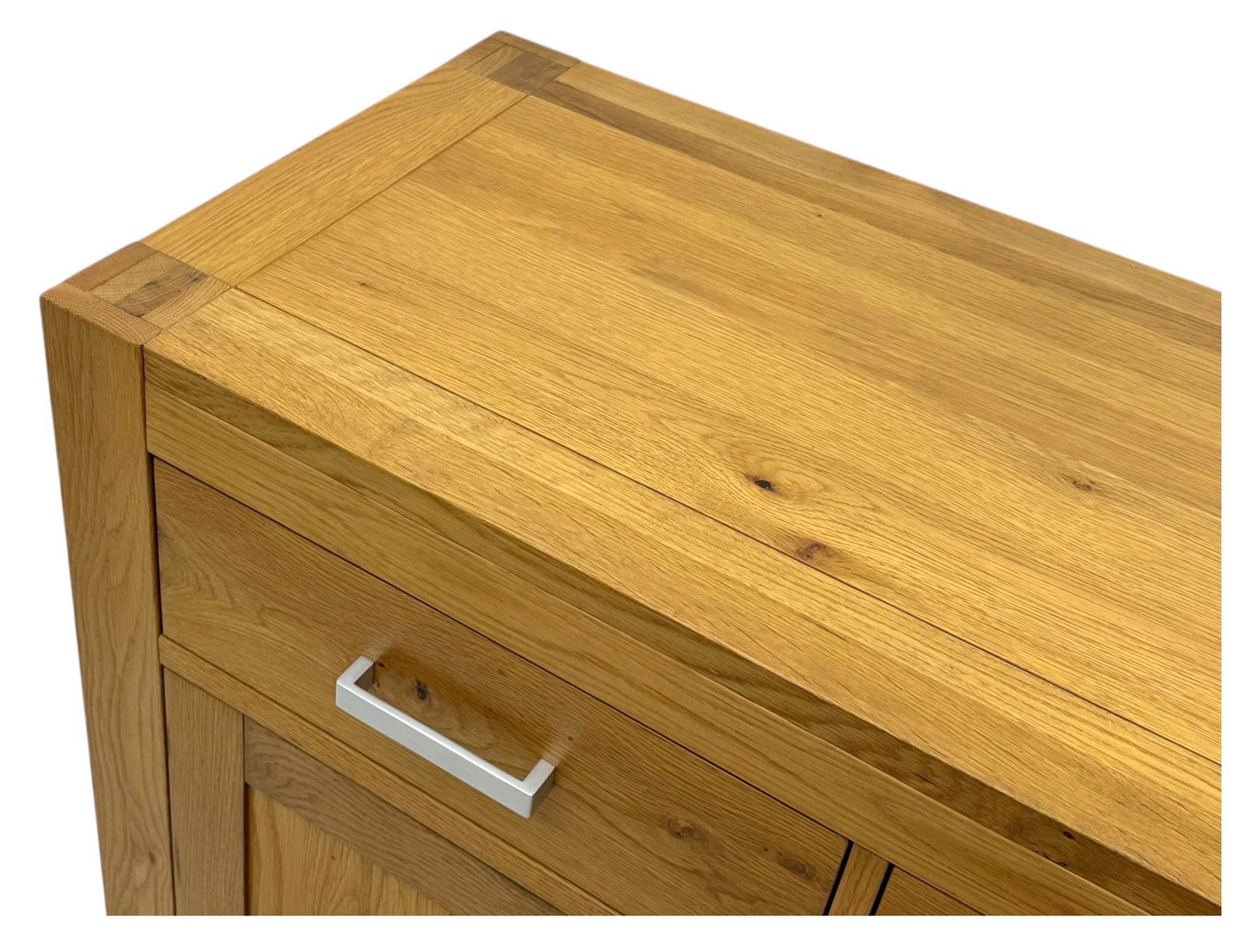 Light oak sideboard, fitted with three drawers and three cupboards, metal handles
