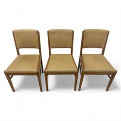 Gordon Russell - mid 20th century teak dining suite, comprising rectangular extending dining table and six matching chairs including one carver, each chair with padded upholstered seat and backrest in vinyl, on square supports, the table with plain top and rounded edges on tapered legs, an example of the firm’s functional post-war design with restrained modernist detailing (Chairs H 85cm, W 47cm, D 46cm) (Extends to 154cm)