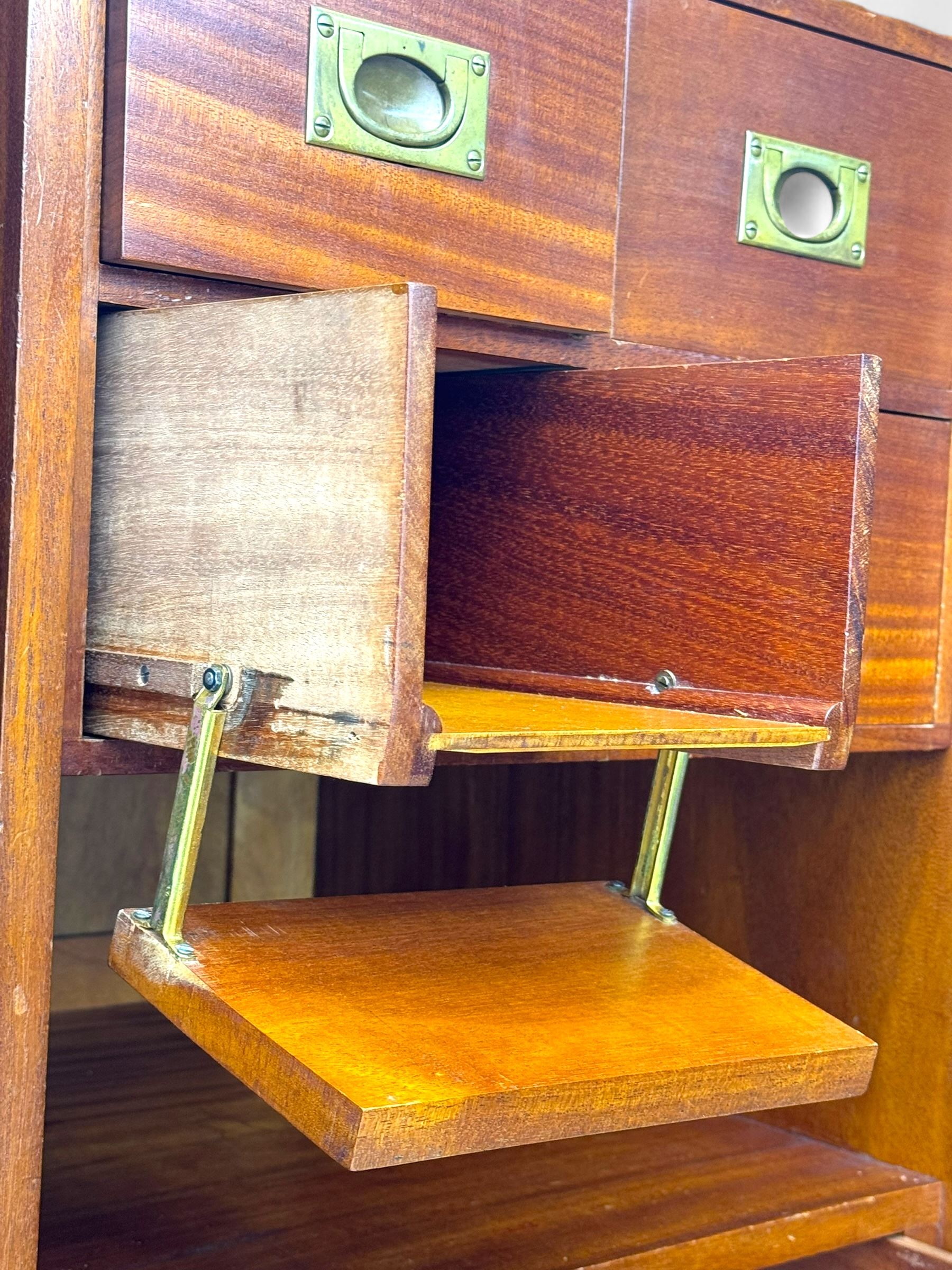 Ashton Leach & Cumberbirch Ltd., Rochdale - early 20th century walnut and mahogany gentleman's wardrobe, arched moulded top with book-matched figured walnut veneers, double doors enclosing fitted interior with hanging rail, tie rack and drawers, raised on cabriole supports
