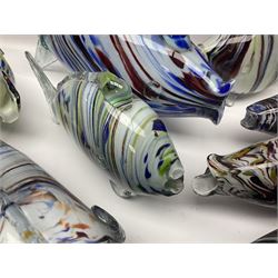 Collection of mid 20th century murano style glass fish, each with multi coloured inclusions largest L42cm