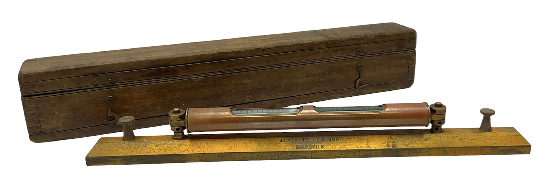 Engineers heavy brass spirit level by J Casartelli & Son, Salford,in original wooden case, box L45cms