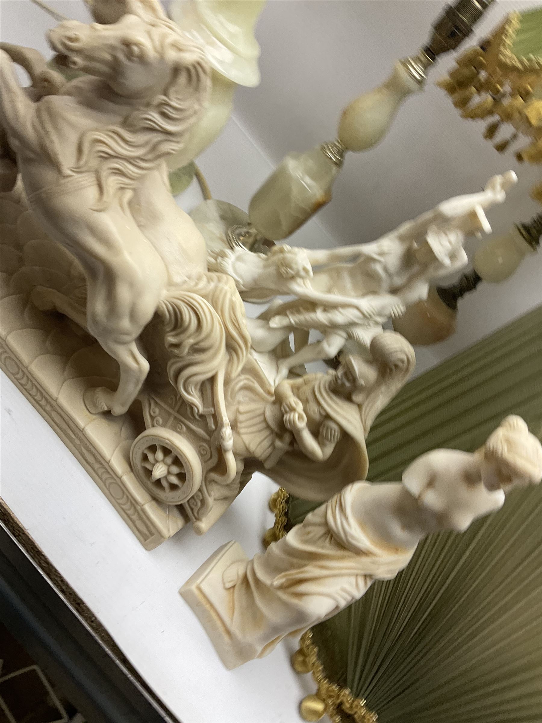 Onyx table lamp, with knopped stem and cream and green tassel shade, together with three smaller similar onyx lamps, classical style alabaster figures and a covered onyx jar