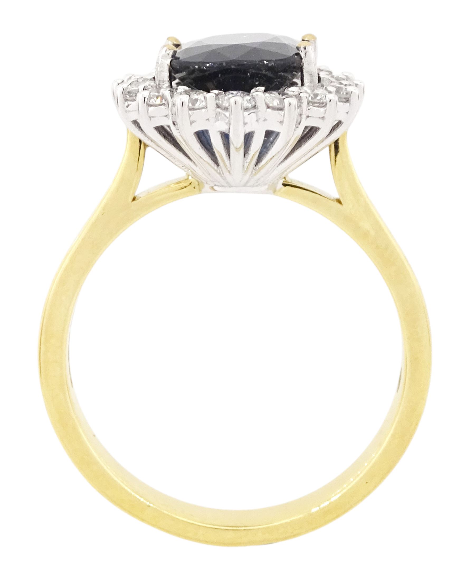 18ct gold sapphire and diamond cluster ring, single oval cut sapphire of approx 2.60 carat, surrounded by sixteen round brilliant cut diamonds, hallmarked, total diamond weight approx 0.45 carat