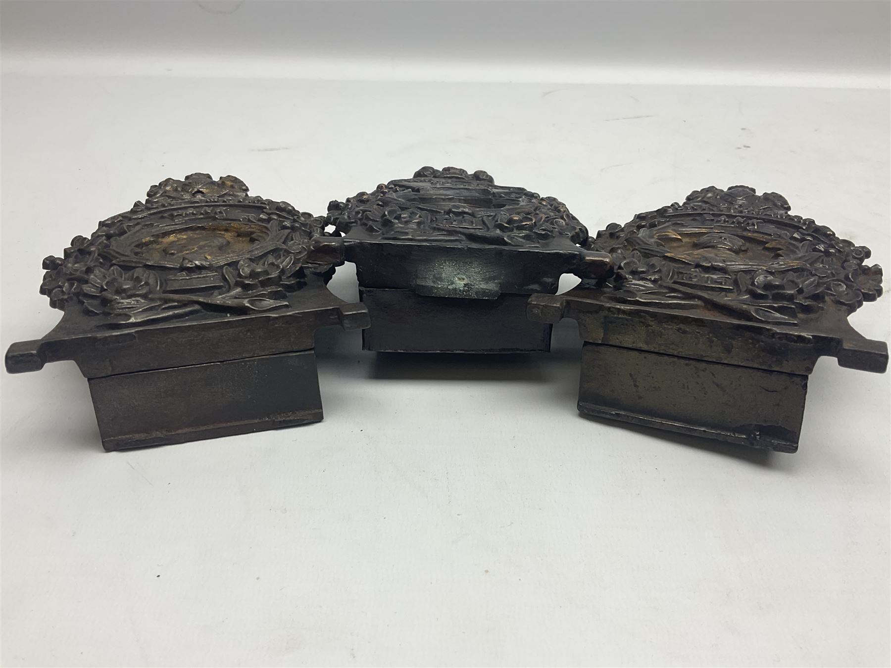 Two early 20th century cast-iron money banks - 'Our Kitchener Bank' c1914 H17cm and 'Our Empire Bank' c1911 depicting George V and Queen Mary H17cm; both by Sydenham & McCoustra; and another similar for The Prince & Princess of Wales 1981 by Robert Brown (3)