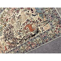 Fine Persian tree of life rug wall hanging, ivory ground field depicting landscape filled with animals, birds and flowers, the guarded border with stylised flower heads and foliage decoration, with brass hanging rail