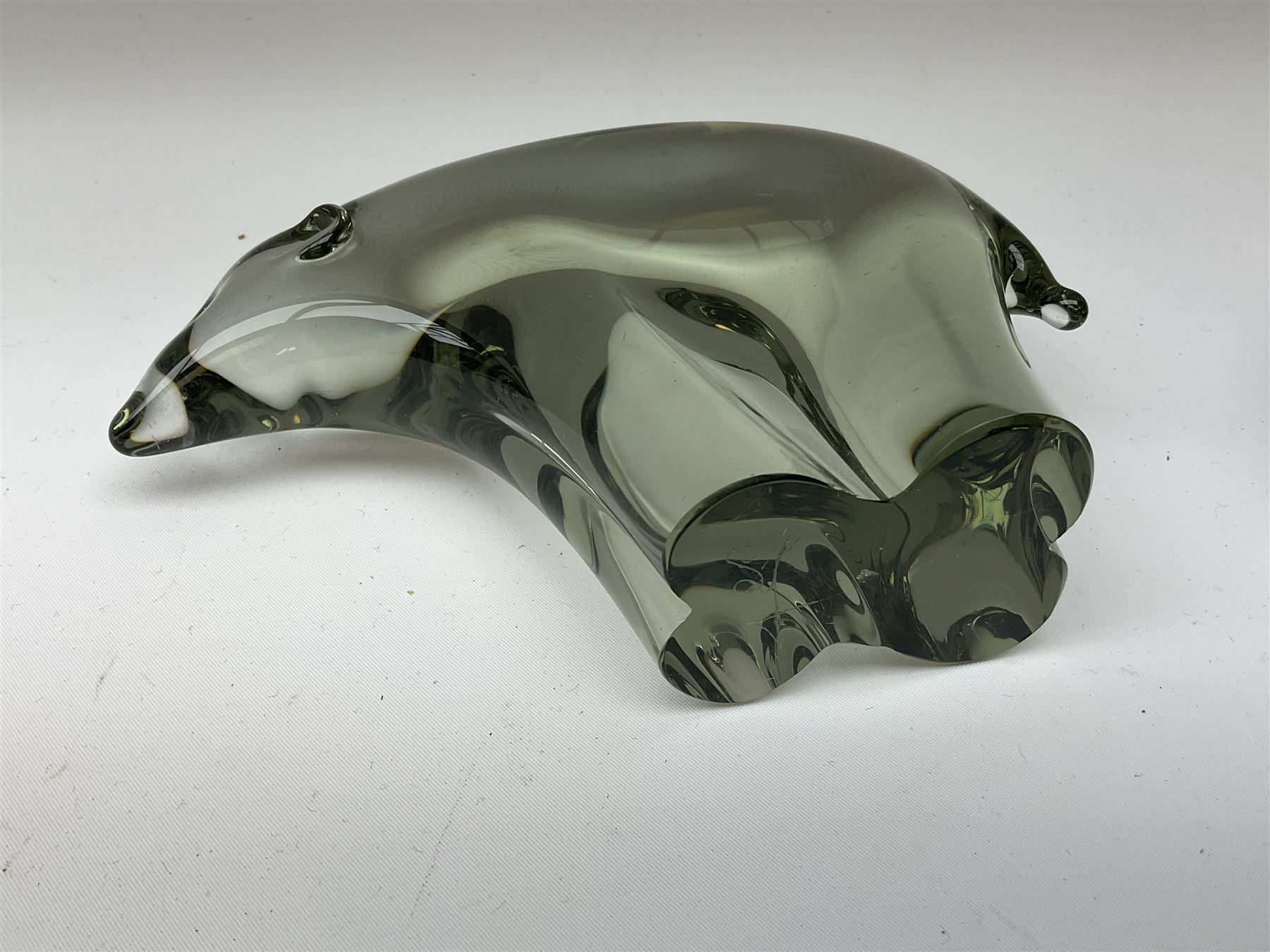 Livio Seguso (Italian, 1930-), Murano glass penguin paperweight in purple and blue, H12.5cm, together with another paperweight modelled as a polar bear for Graglas of Germany, c1970, both with etched marks beneath