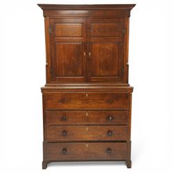 George III oak and mahogany bound enclosed bookcase-secretaire, panelled cupboards over four drawers