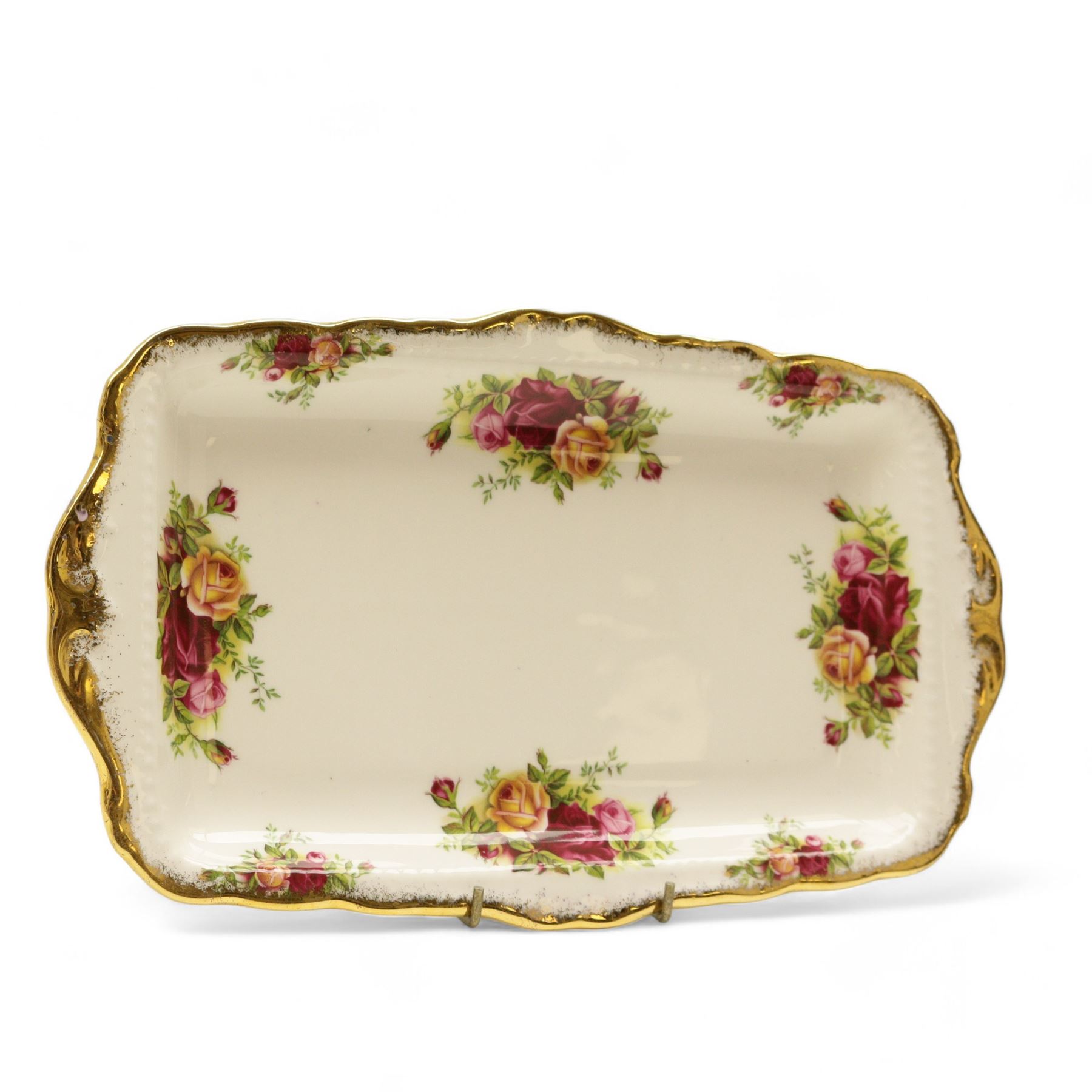 Royal Albert Country Roses tea and dinner service, teapot, milk jug, covered sucrier, eight dinner plates, eight teacups and saucers 