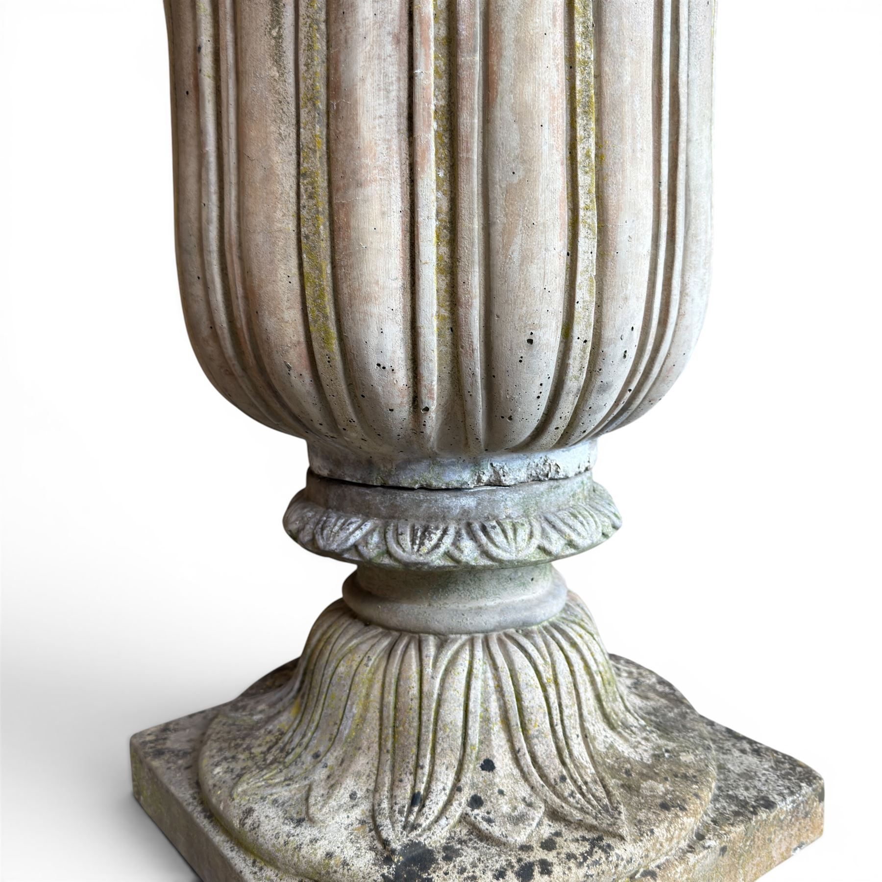 Cast stone tulip urn, petal rim with bell shaped bowl on squat base, stamped HGC; with associated plinth (2)