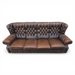 Georgian design Chesterfield lounge suite, comprising highbacked four seat sofa and pair armchairs, upholstered in chocolate brown leather, Armchairs (H 90cm, W 91cm) Sofa (H 91cm, W 238cm)