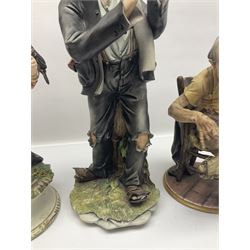Three Capodimonte figures, to include The Kind Heart Man, modelled by Cortese as a tramp with two doves, The Young Falconer by Maria Angela and another modelled as a tramp darning his socks, all with printed marks, tallest H39cm