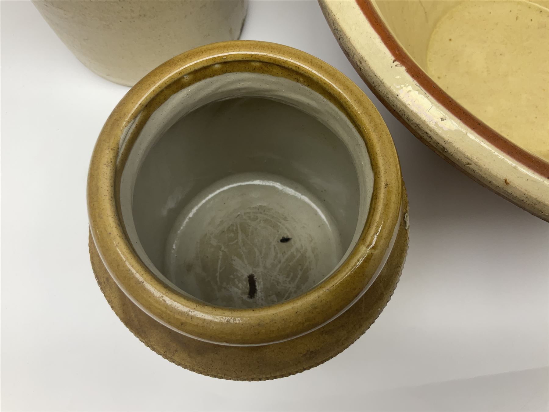 Terracotta bread proving bowl, together with three stoneware jars, tallest H26.5cm