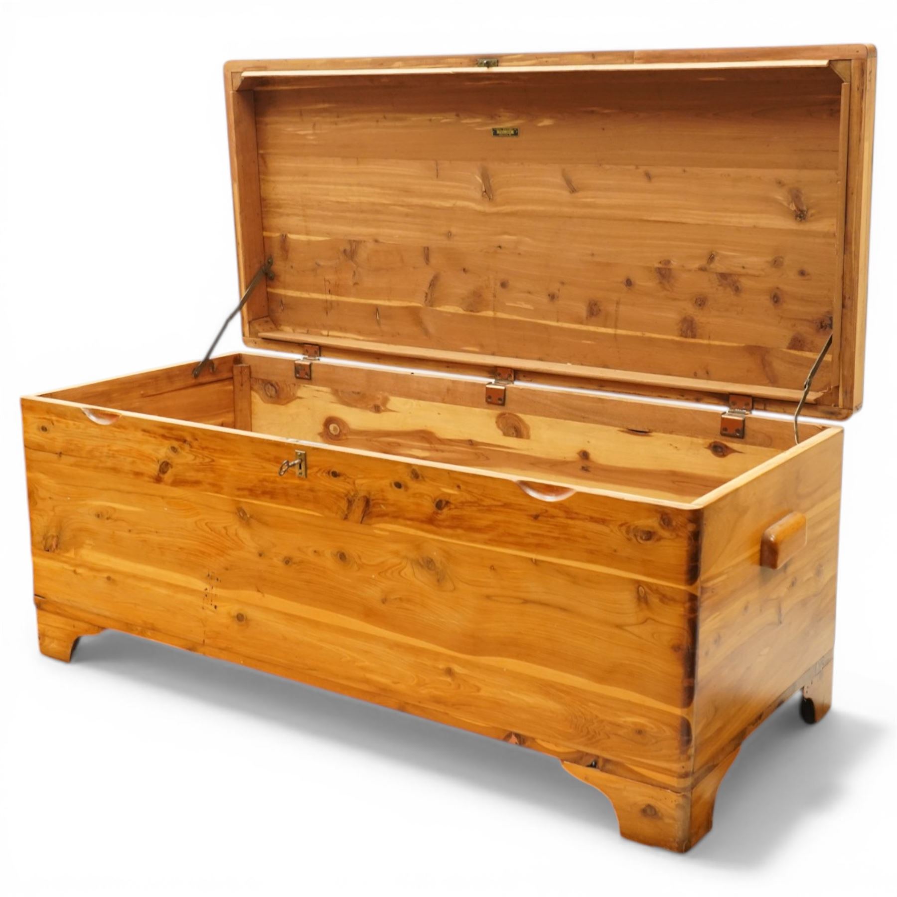 20th century American pine blanket chest, raised on bracket feet, makers label to interior