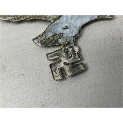 Imperial German Prussian Army Service Veterens Association badge; 'SS' type first pattern cap skull; Luftwaffe metal eagle uniform insignia; and another metal eagle cap insignia (possibly police?) (4)