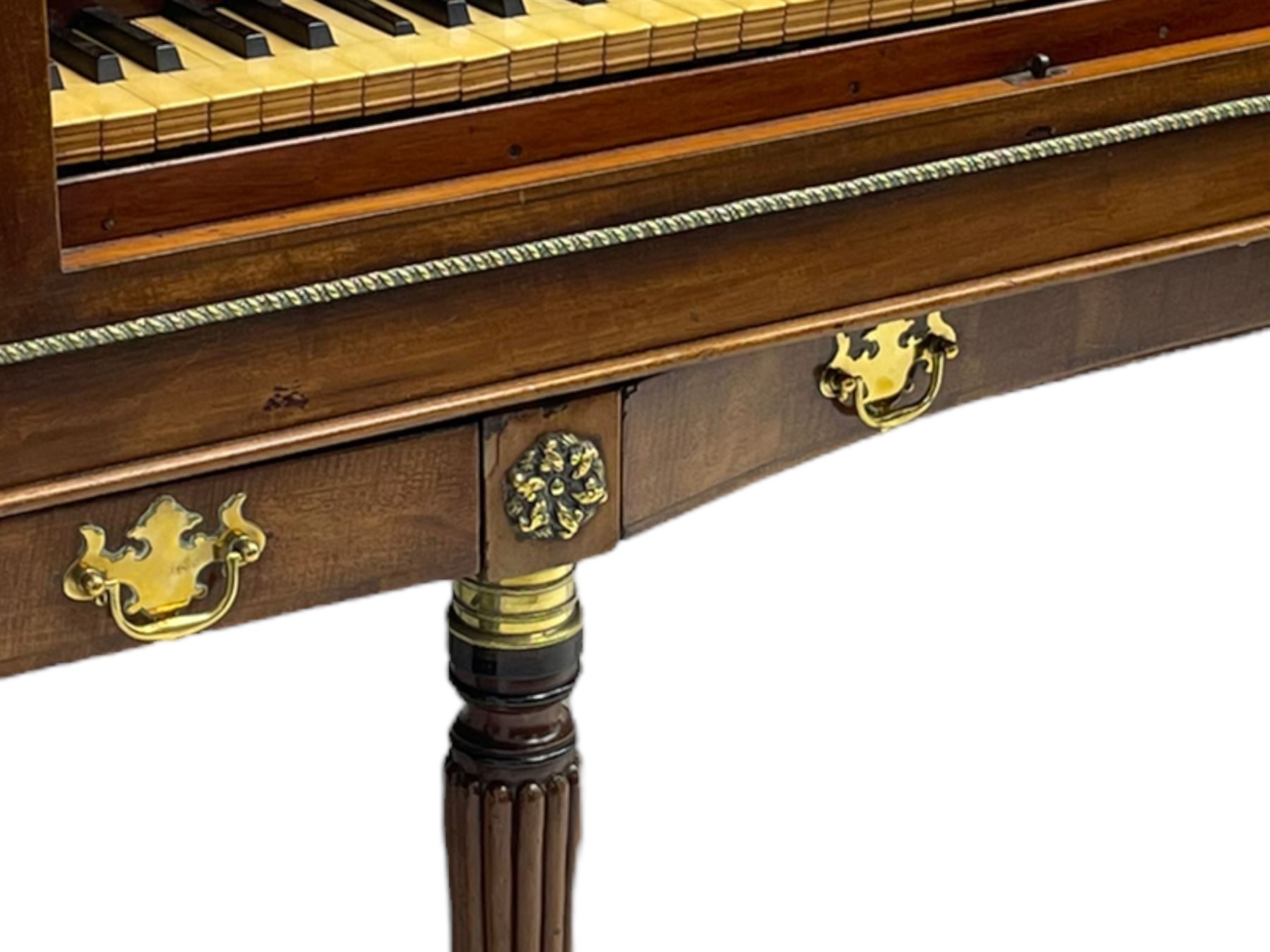 James Rigg, London -early 19th century mahogany and maple square piano c1817, with a 68 key compass (A-C) original hammers, jacks and felt, satinwood interior with ebony and ivory keys, the fretwork interior back inscribed 'James Rigg, 3 Providence Row, Finsbury Square, London', decorated with twist gilt metal edging, fitted with three drawers, on Gillows design turned and reeded supports with brass cups and castors.

This item has been registered for sale under Section 10 of the APHA Ivory Act