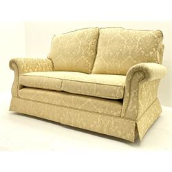 Two seat sofa (W167cm), and matching armchair (W97cm), upholstered in pale cream fabric with raised foliate pattern