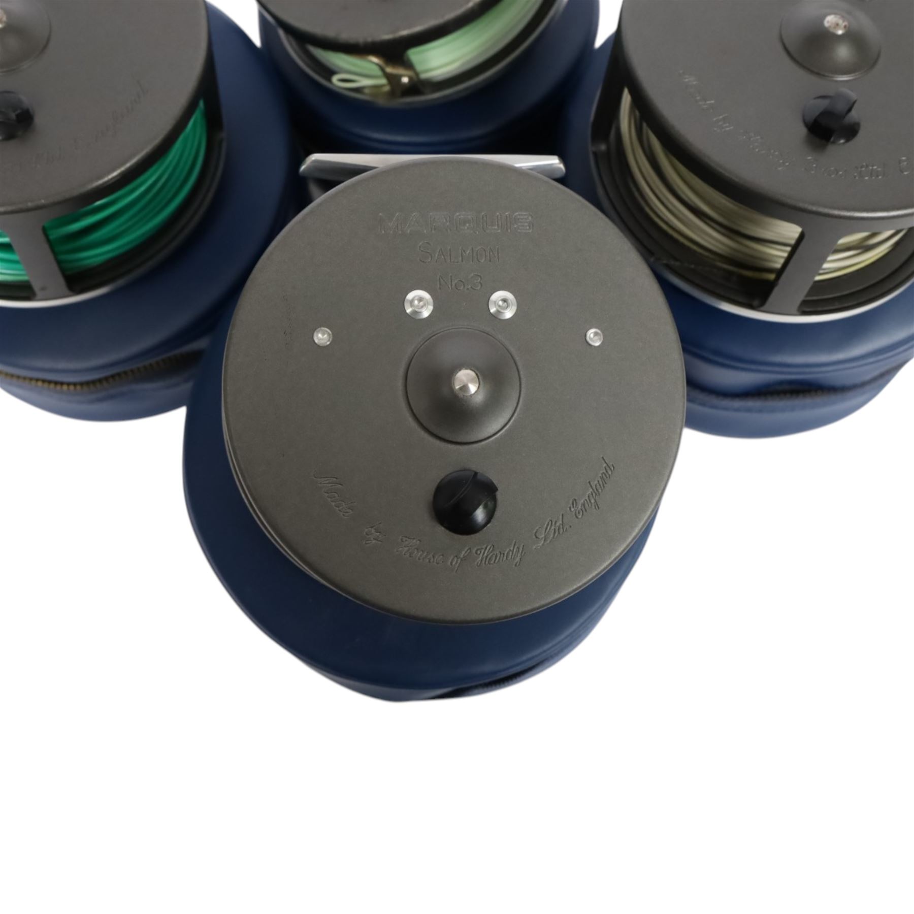Four Hardy Bros Marquis fly fishing reels, comprising three No. 3 salmon reels and a No.1 Salmon reel, all within blue Hardy cases