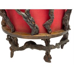 Mid-20th century French grapevine and walnut bow-front wine tasting bar, the curved counter top supported by sculptural grapevine roots, fitted with single shelf and raised on rustic vine feet (W100cm H101cm); with a pair of matching bar stools, the circular top raised on three gnarled root supports united by stretchers (W50cm H70cm)