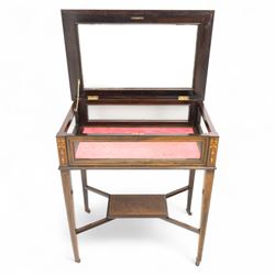 Edwardian rosewood bijouterie cabinet, the hinged rectangular top with line inlay enclosing a velvet lined interior, upon slender tapering legs inlaid with satinwood foliate marquetry decoration, with stretchers united by an under tier, raised on castors 
