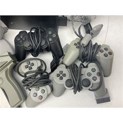  Playstation original console, with three controllers and two predator guns, together with Playstation2, controller and a large collection of games, untested 