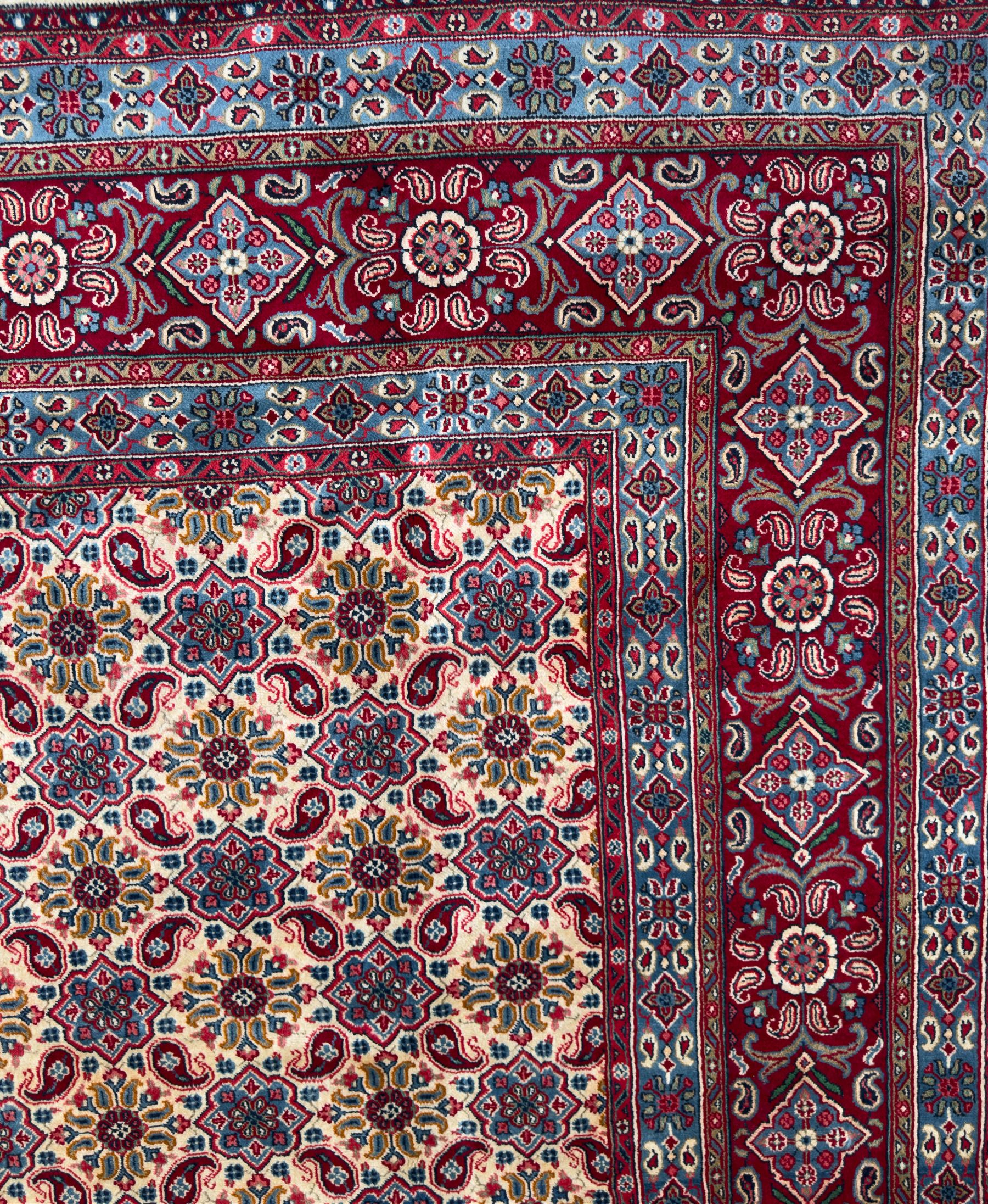 Northwestern Persian Hamadan carpet, hand-knotted, ivory field with an all-over Herati design of rosettes and serrated leaves within multiple borders, madder red with angular vine and rosette motifs, 375cm x 271cm 
