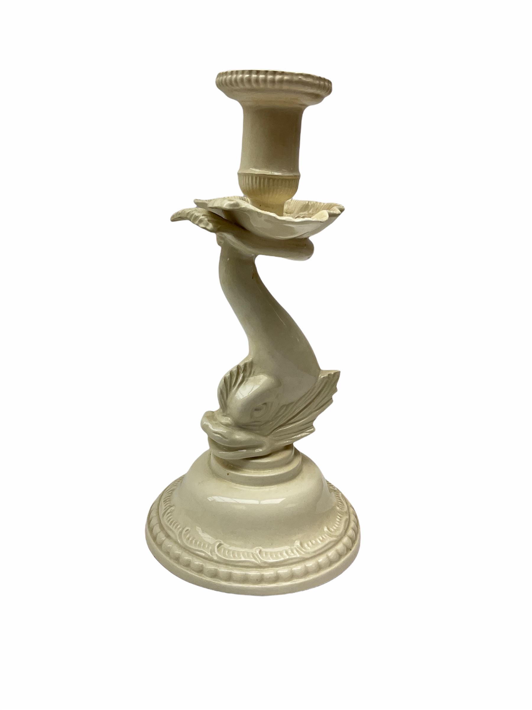 20th century Leeds creamware, comprising chestnut basket and stand, small tureen and cover, ladle, and associated stand, candlestick with stem modelled as a dolphin, teapot, tureen and cover in the form of a melon with fixed stand, and toast rack (toast rack a/f), each with impressed mark beneath. 