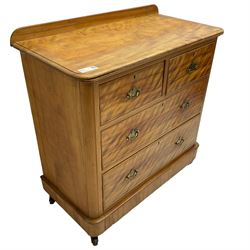 Victorian satin walnut chest, raised back over two short and two long drawers, skirted base with castors