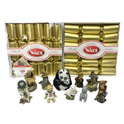 Nine Wade Collectables figures, comprising six Myths and Legends; King Canute, Mermaid, St George, Cornish Tin Mine Pixie, Puck and Green man, together with Lamb, Elephant and bear, a Wade Panda money box and two boxes of Wade Christmas Crackers