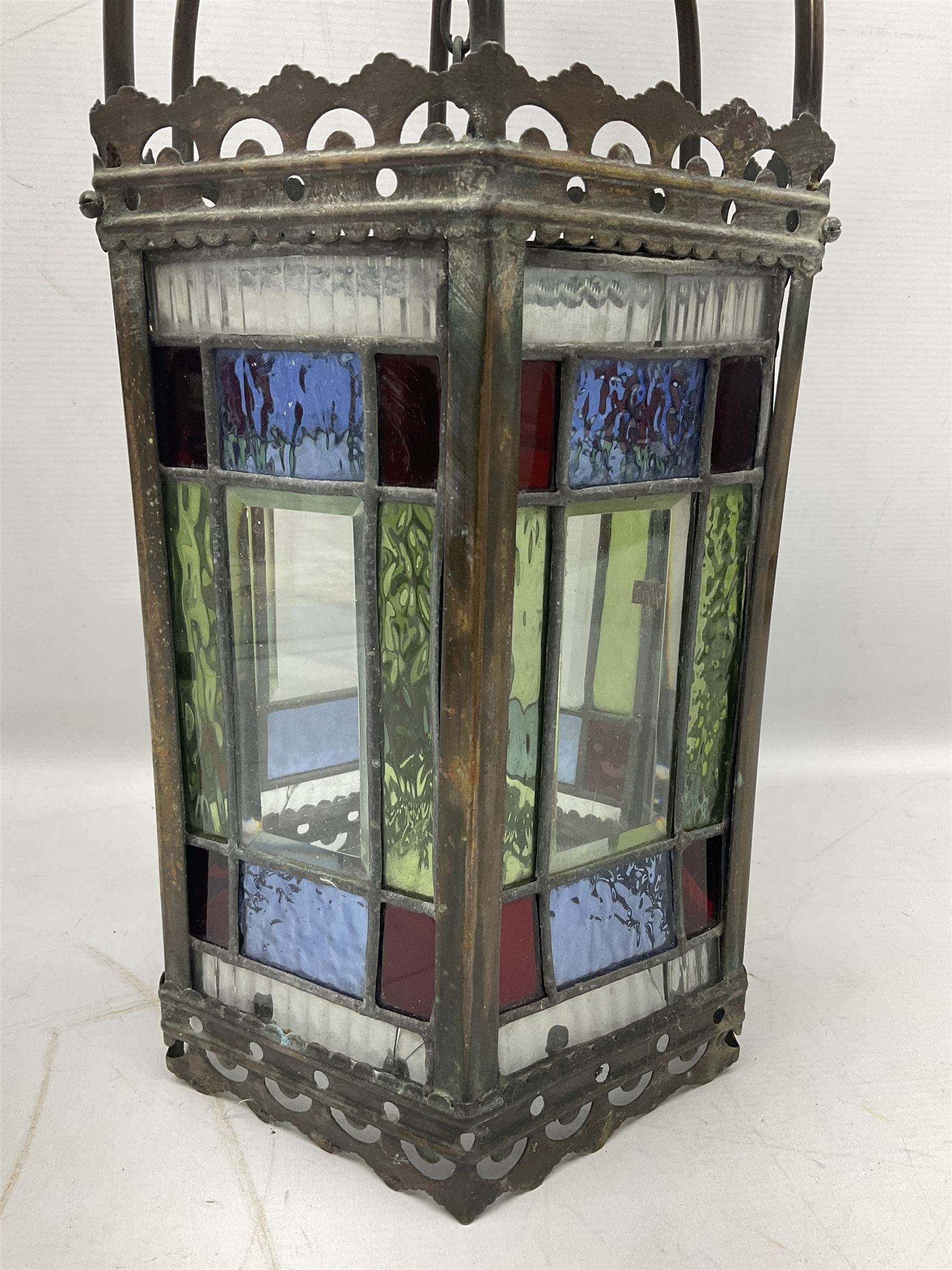 Victorian brass and stained leaded glass hall lantern, of hexagonal form, supported by four domed arms and pierced fret, H46cm W20cm