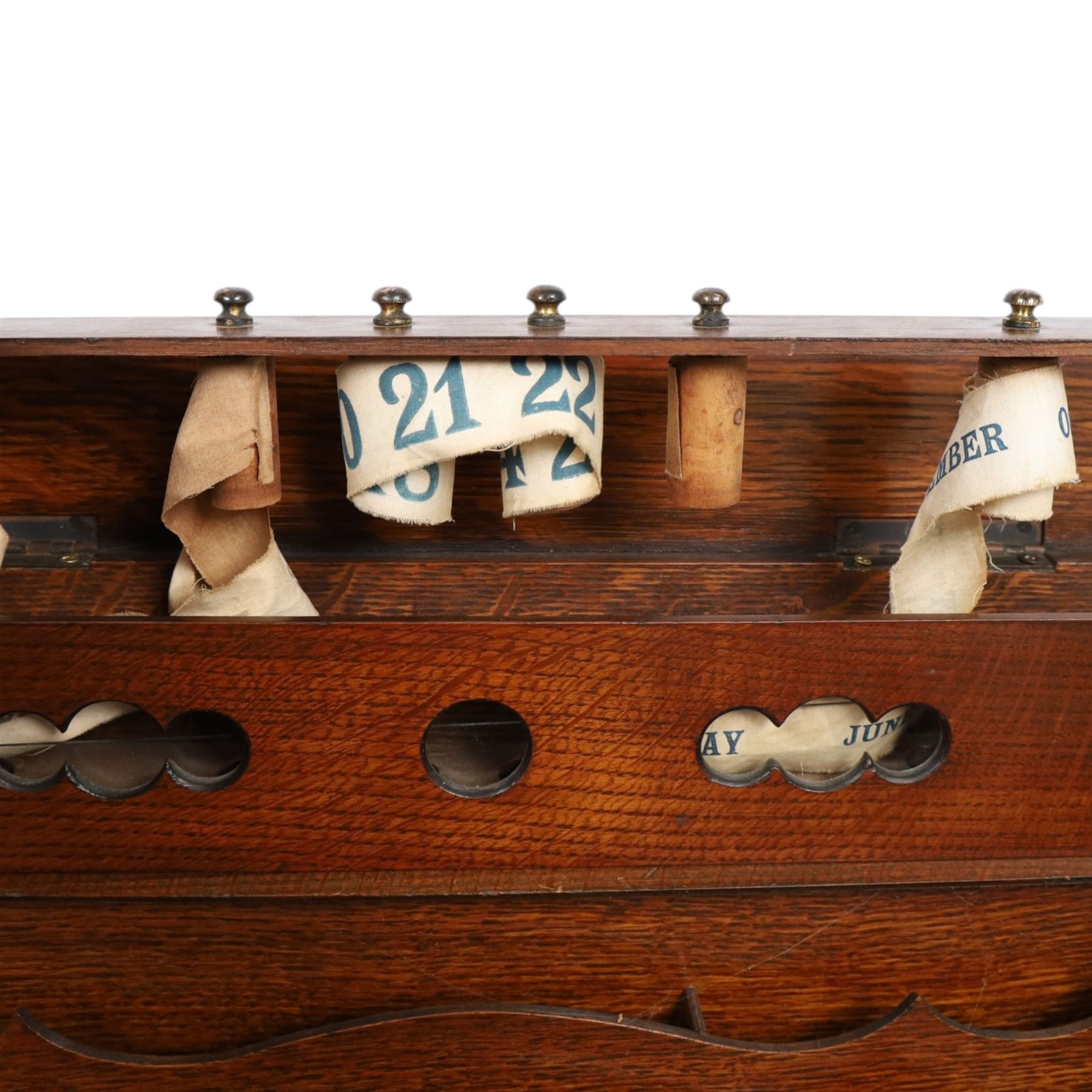 Victorian oak perpetual calendar roll-top desk, tambour front enclosing fitted interior with pigeonholes and pen trays, the raised back fitted with rotating date and month apertures, over single frieze drawer with cast brass handle, on plinth base