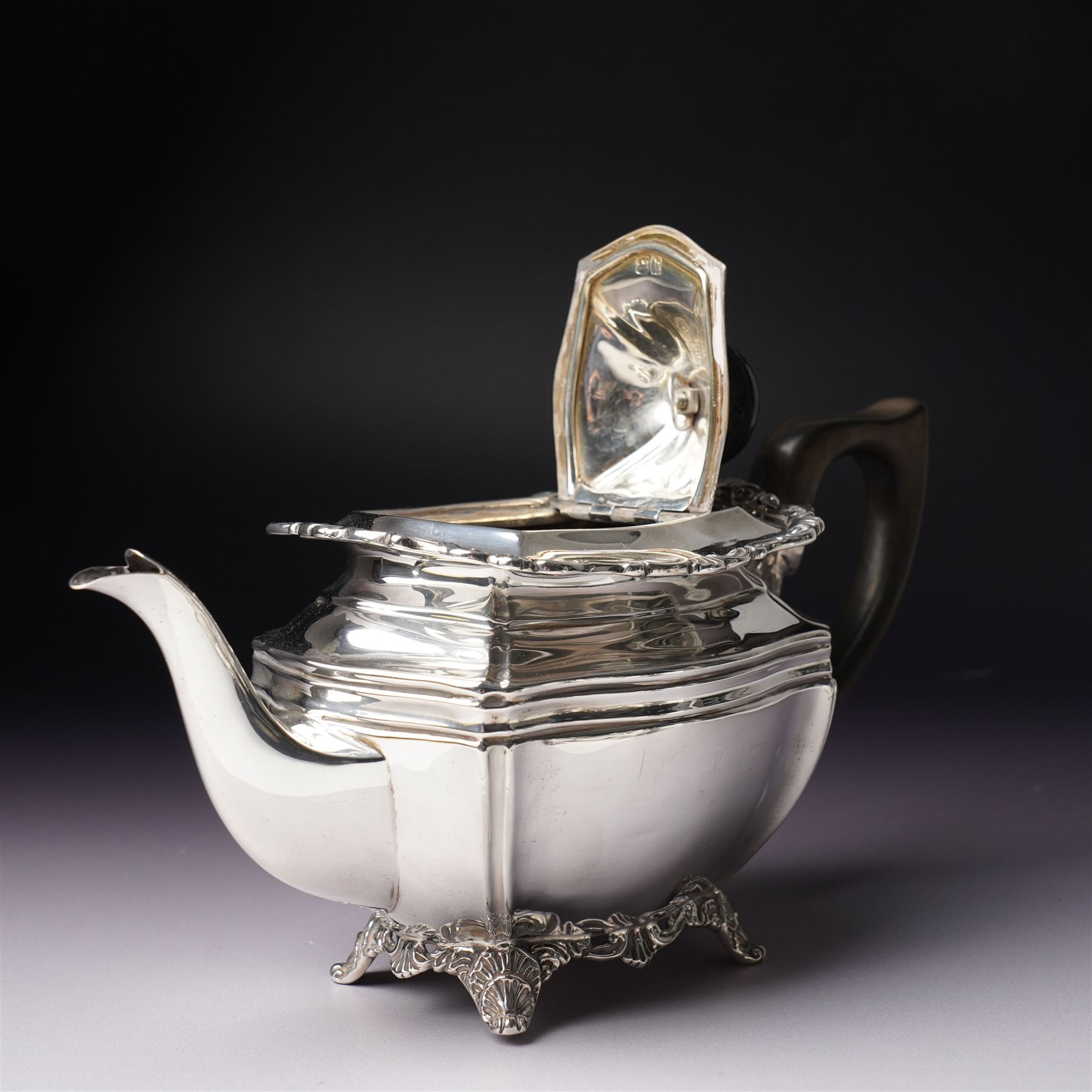 Edwardian silver three piece bachelors tea set of panel sided rectangular form with shell and scroll borders on shell moulded feet London 1903- 1905 Maker Josiah Williams & Co