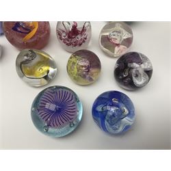 Collection of paperweights to include Caithness and similar, Caithness examples including Moonbeam, Mooncrystal, Pebble, Petunias etc (22)