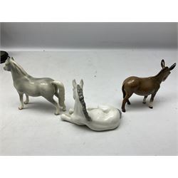 Collection of Beswick horse figures, to include Red Rum on a wooden plinth,  Lammtarra on oval plinth, Morgan Horse Black and three others, together with Royal Daulton Appaloosa Foal and a USSR horse
