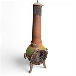 Garden chiminea, with mesh front spark guard, flue chimney on three splayed legs, in a weathered finish