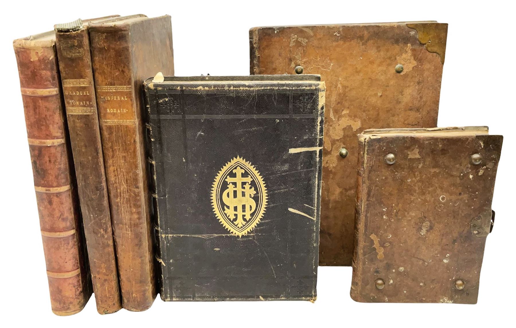 Six 19th century leather bound books of music comprising Graduale Juxta Missale Romanum and Antiphonarium Romanum. Both 1828 Divione; Graduel Romain and Psautier Romain. Both 1859 Digne/Paris; Graduel Romain. 1872 Marseille; and Missale Romanum. 1853 Mechliniae (6)