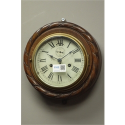  20th century ship's bulkhead type clock, carved beech rope twist surround, Roman dial with subsidiary seconds dial, enclosed by bevelled glass and brass bezel door, D23cm  