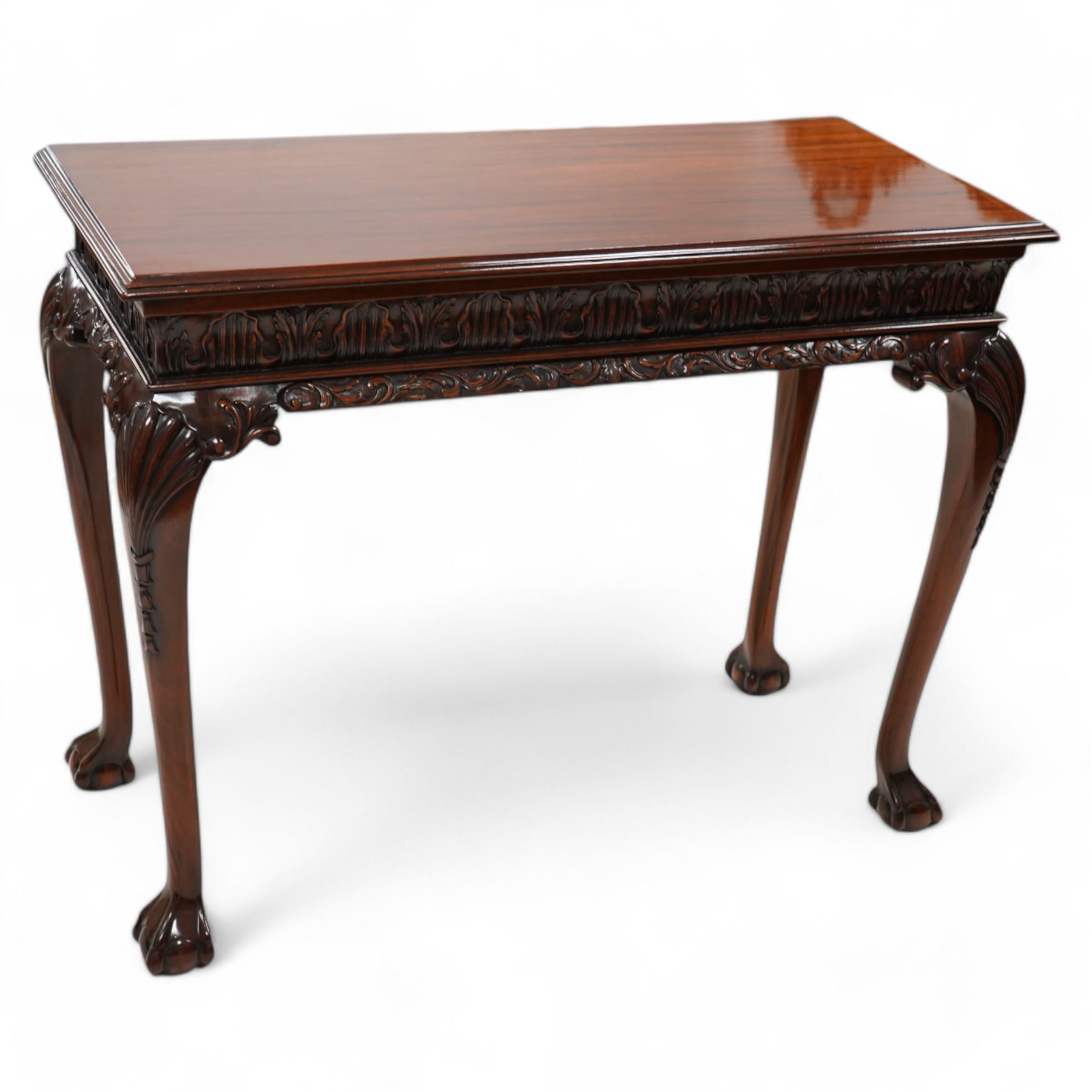 Georgian design mahogany console or side table, moulded rectangular top over palmette carved frieze, decorated with scrolling leafage, shell and bell flower carved cabriole supports with ball and claw feet 