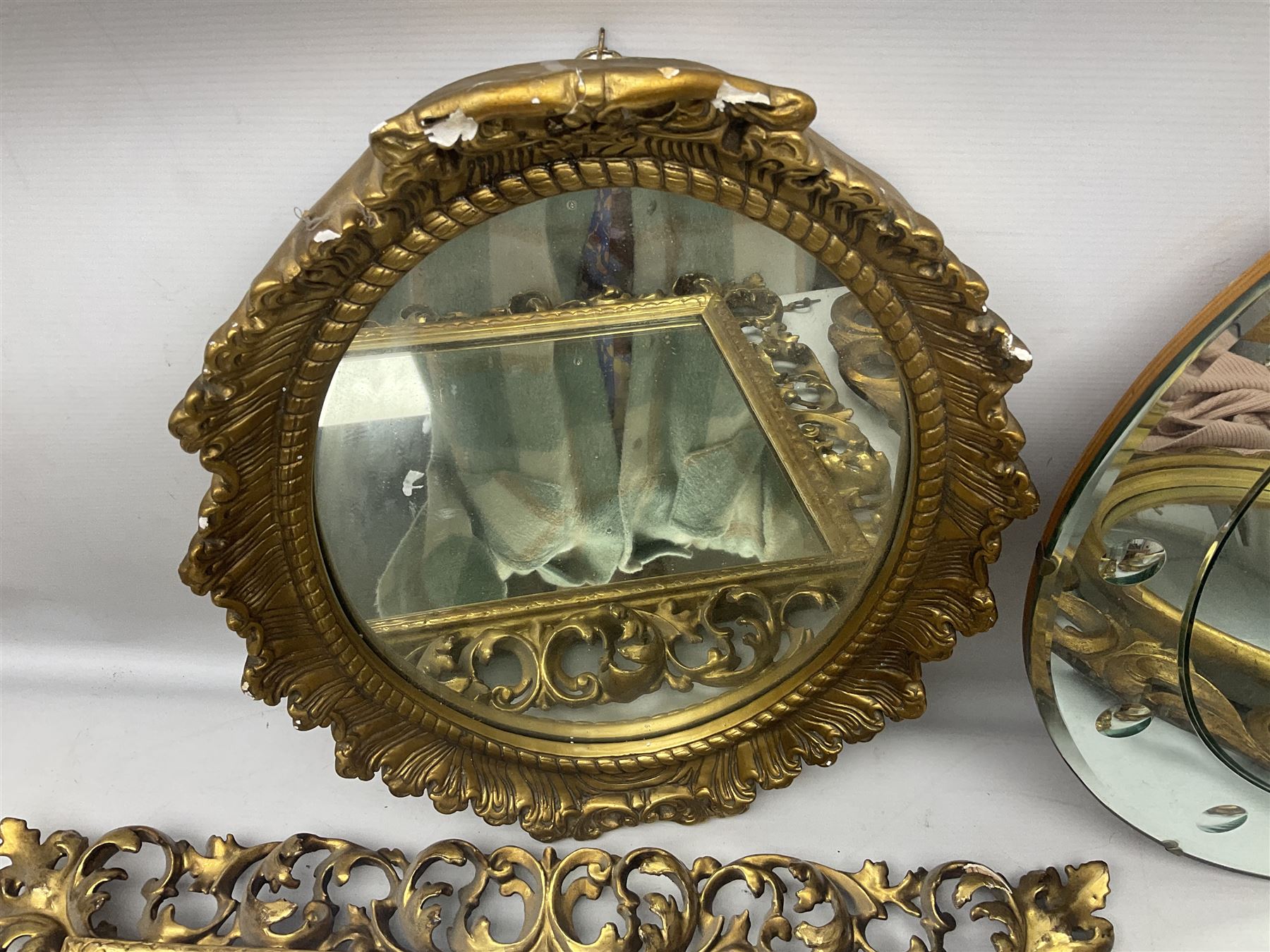 Three Rocco style gilt mirrors, together with another mirror, largest example H64cm 