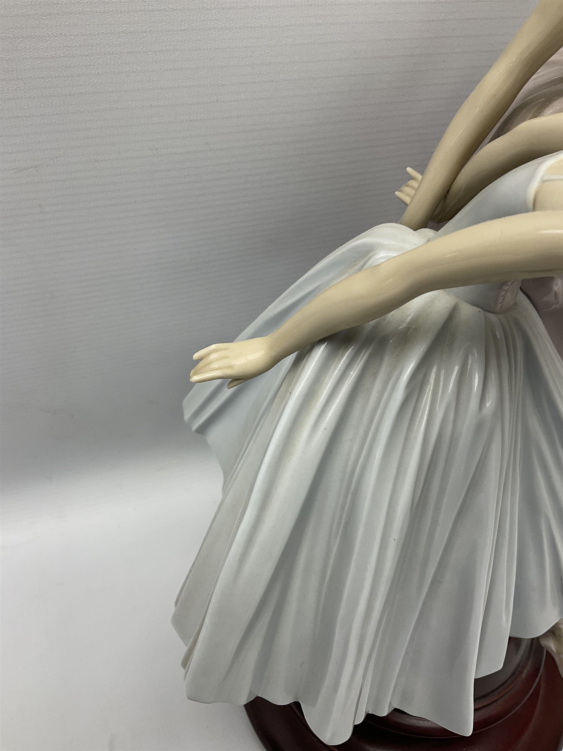 Lladro figure group, 'Merry Ballet', modelled as two ballerinas in dancing pose, raised on a turned socle base, no. 5035, printed marks beneath, H49cm