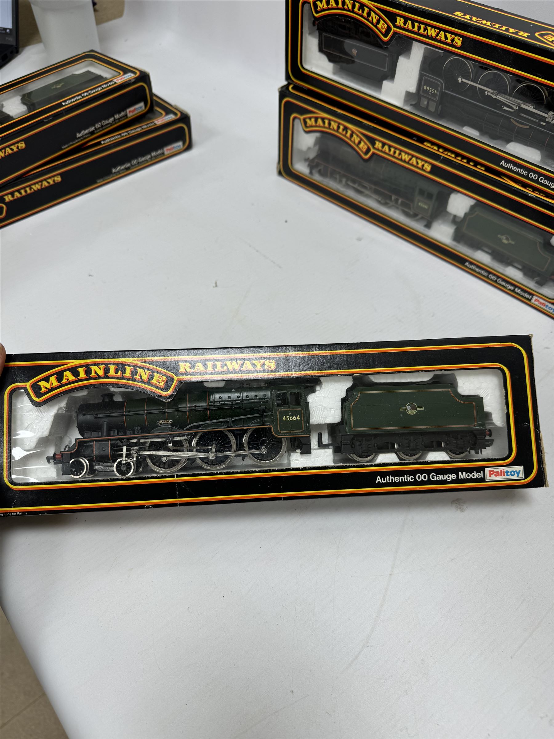 Seven Mainline Railways '00' gauge Jubilee Class 4-6-0 locomotives, comprising five 37062 in BR green livery, reworked as United Province no. 45578, Newfoundland no. 45573, Bellerophon no.45694, Nelson no. 45664 and no. 45691, 37047 Mars locomotive no. 45698 with Fowler tender in BR green livery and 936153 Western Australia locomotive no. 45568 in BR black livery, all boxed