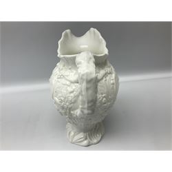 Pair of early/mid 19th century Copeland and Garrett white glazed pitchers, modelled in the Georgian style and moulded with the figures of Venus the Roman Goddess of Love, and Aurora the Roman Goddess of Dawn, within C scroll borders and foliate surround, the naturalistically modelled handle leading to a fruiting vine beneath the rim, upon a spreading base moulded with seashells, with printed green crowned wreath mark beneath, H20cm