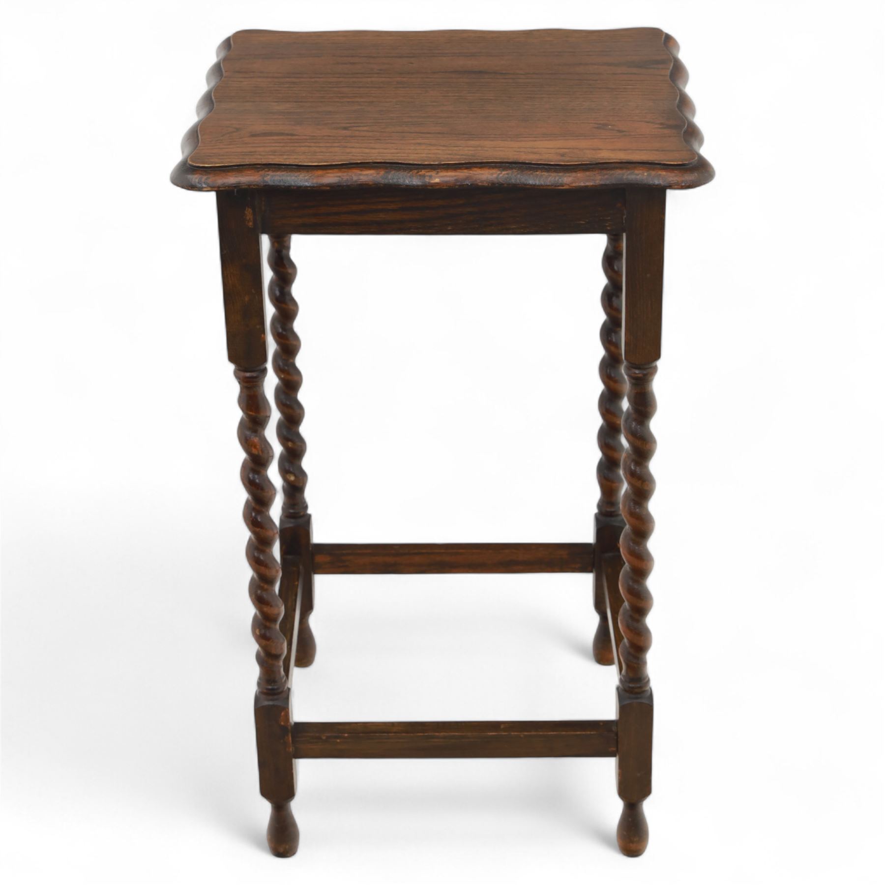 Early 20th century mahogany side table; with bedside cabinet, shaped rectangular top on barley twist supports united by stretchers (H 72cm, W 42cm, D 45cm), together with a Late Victorian tiger bamboo occasional table, rectangular two-tier form with woven cane surfaces, the upper tier with raised edge above splayed supports with naturalistic jointing (H 70cm, W 52cm, D 36cm)