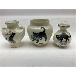 Five crested ware Good Luck black cats, comprising two Willow Art examples, two Arcadian examples and one Carlton China, to include Bridlington, Hull, Filey, etc, tallest H9cm