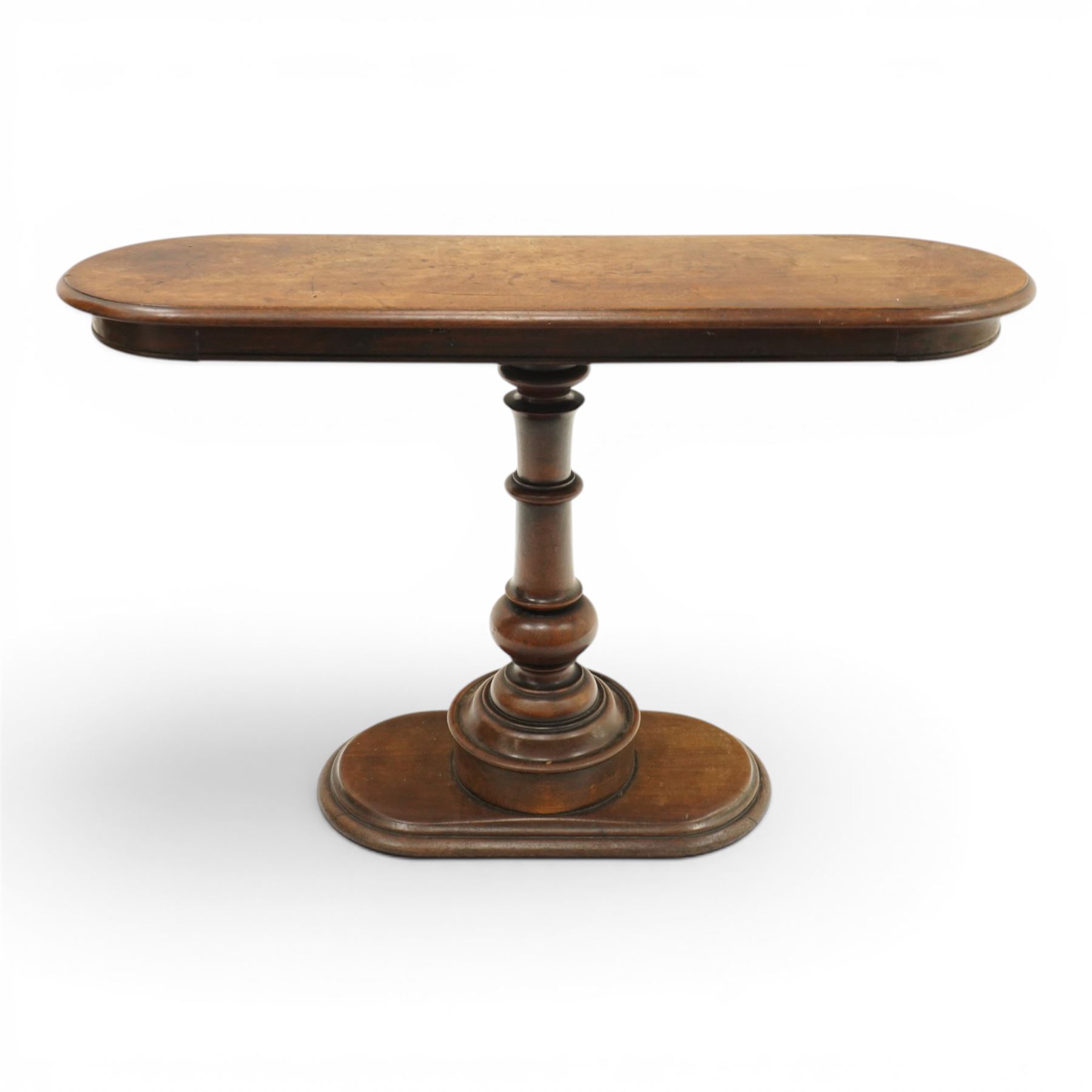 Georgian mahogany console table, the top of oval form, above a turn vasiform column, above an oval plinth base 